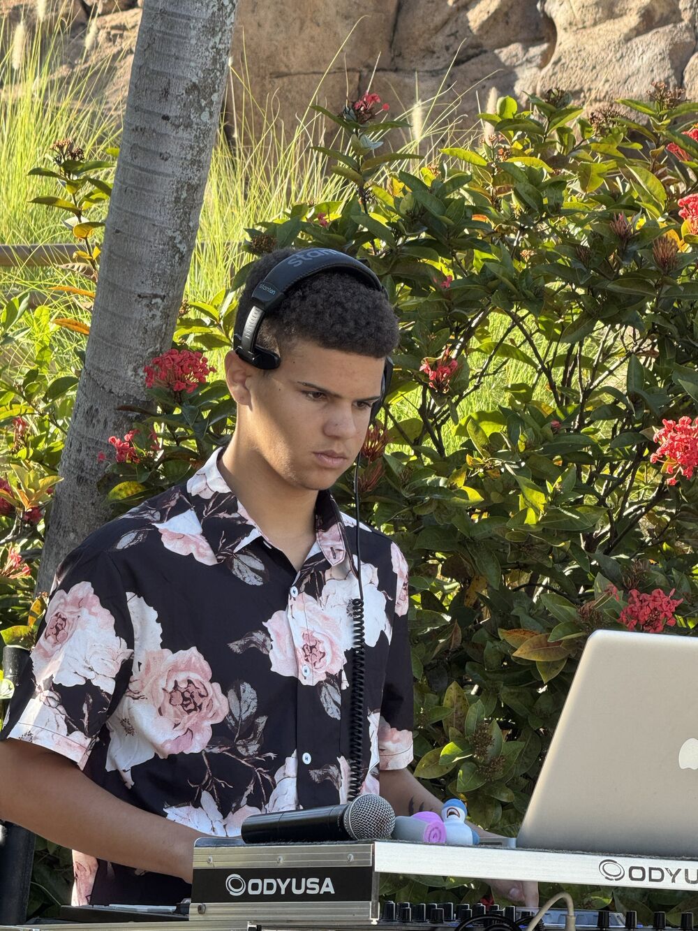 Tyson Wilson, DJ Primetime, mixing at an outdoor event